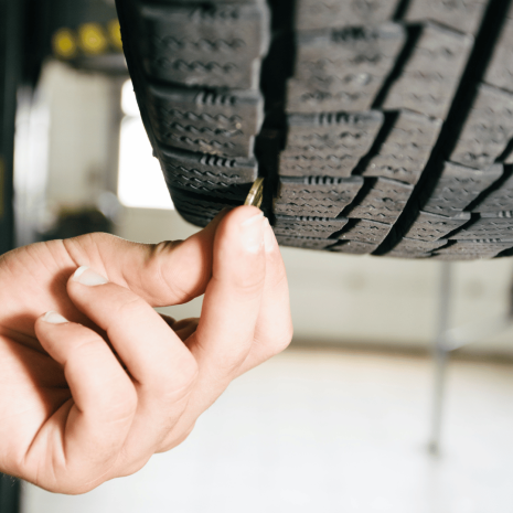 checking tyre with 20p