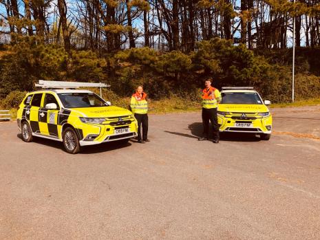 South Wales Traffic Officers in front of cars